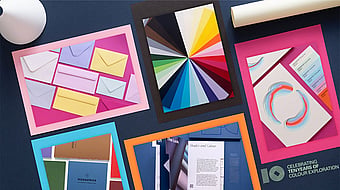 packshots of colourful printing paper on a black background