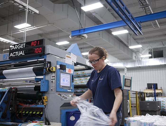 woman removing plastic